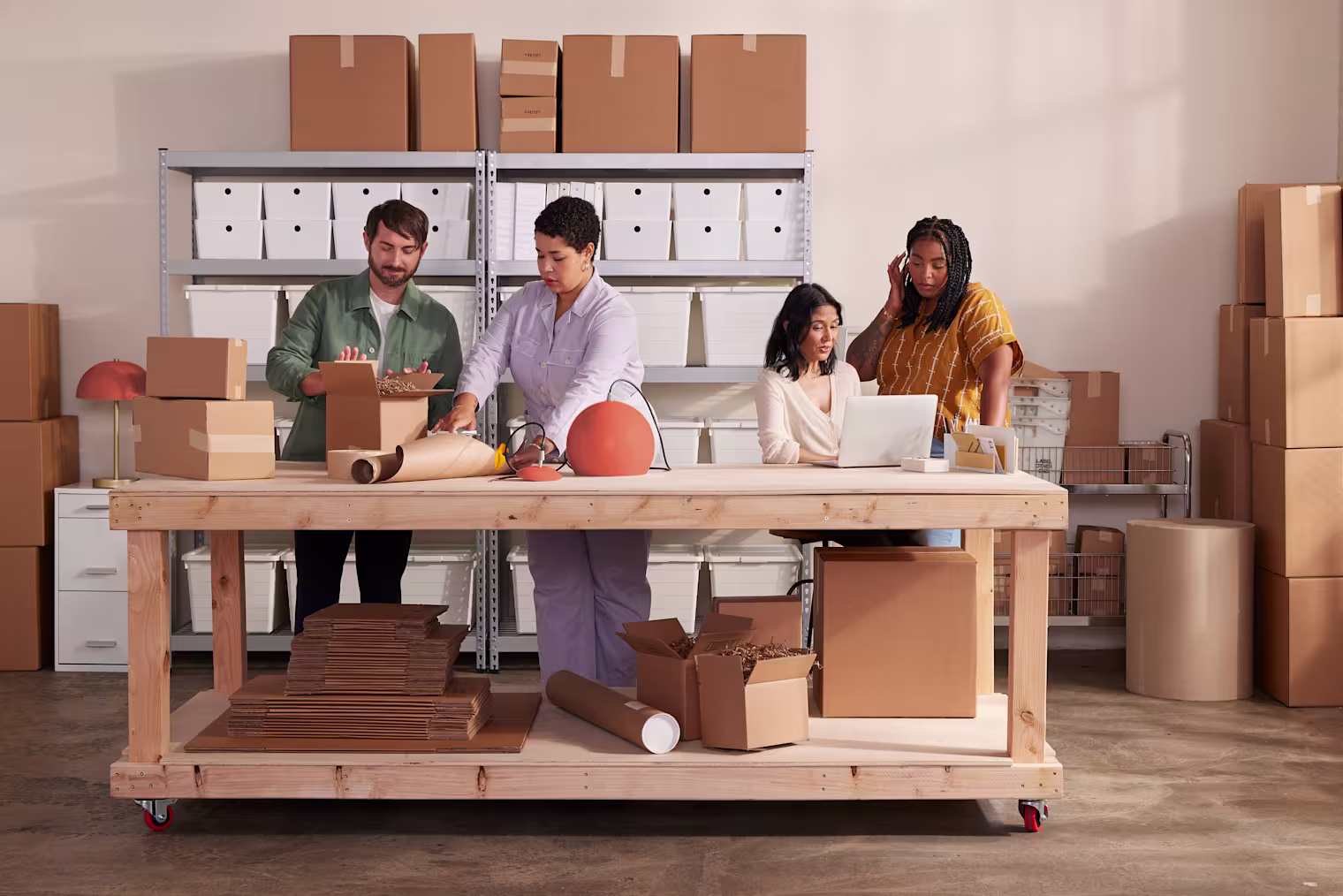 Team preparing orders in studio warehouse
